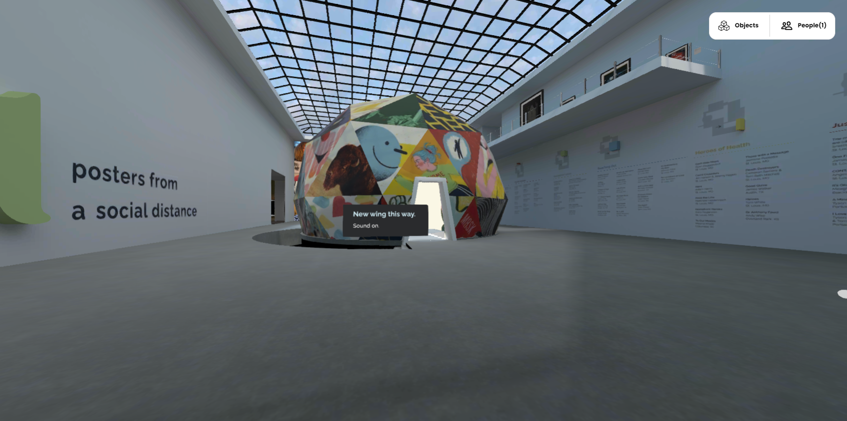 First impression from the Apart Gallery. Ahead is a geodome covered with art images. The surrounding space is a gray and white modern art gallery.